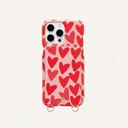 Coque iPhone avec étui en cuir imprimé coeurs avec anneaux dorés