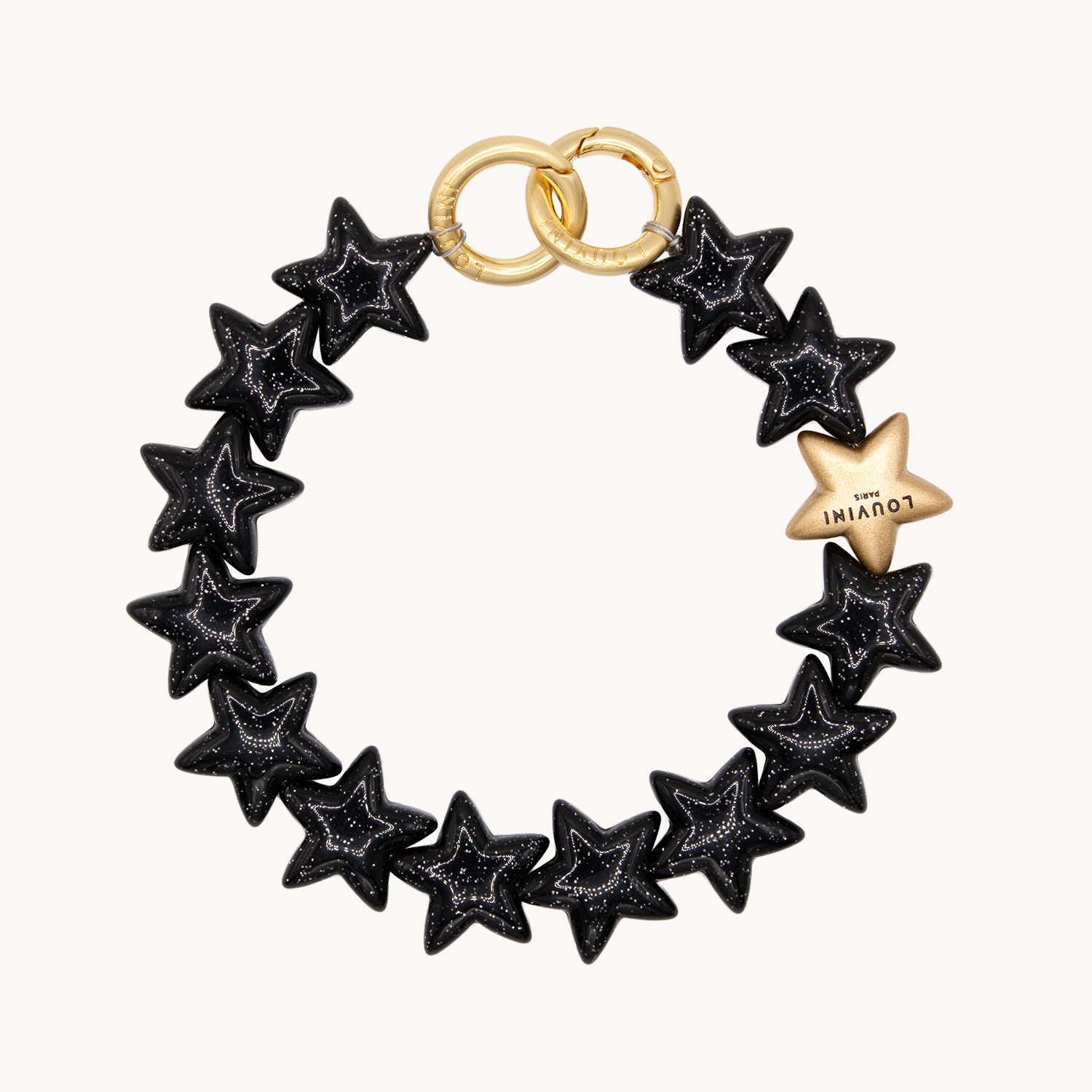 Bracelet de téléphone étoiles noir à paillettes et anneaux dorés