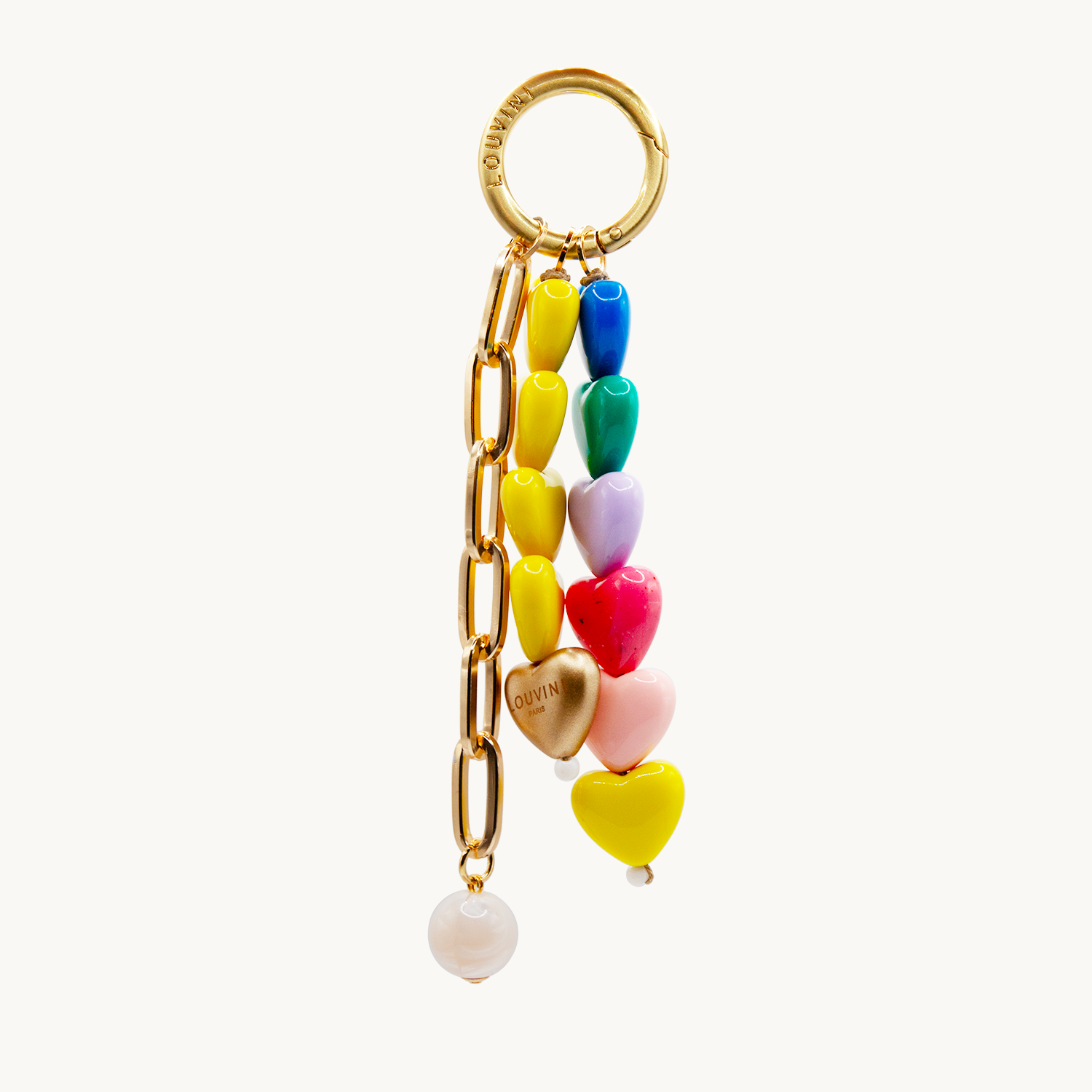 Grigri pour sac ou coque de téléphone, finitions dorées et petits cœurs colorés