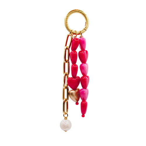 Grigri pour sac ou coque de téléphone, finitions dorées et petits cœurs rose et rouge