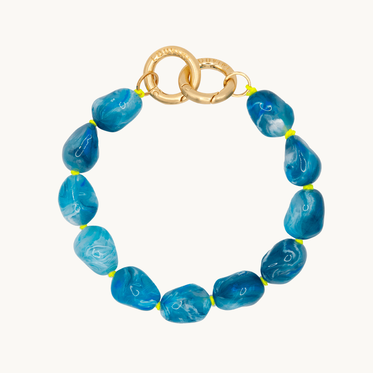 Bracelet pour téléphone avec pierres en résine et anneaux dorés