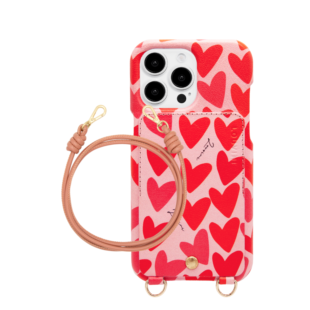 Coque iphone en cuir imprimé coeurs et porte carte et cordon en cuir assorti rose