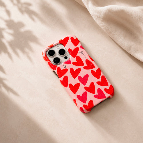 coque iphone en cuir rose imprimé coeurs rouges louvini avec magsafe intégré