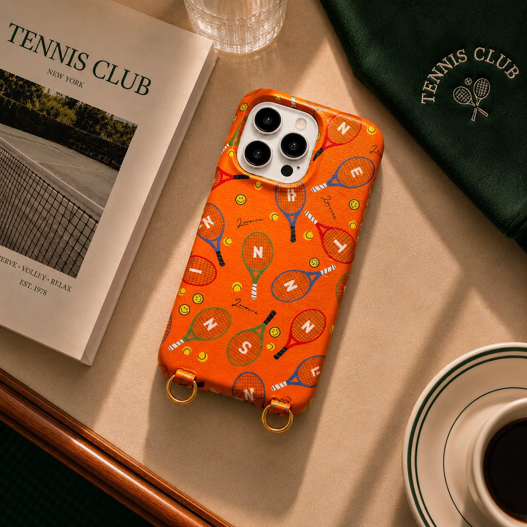 coque iphone en cuir imprimé raquettes de tennis orange avec smileys et anneaux